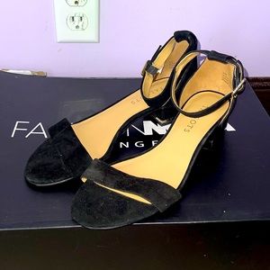 Black heel sandals with gold accents